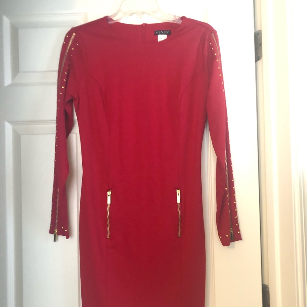Dress with zipper embellishments.